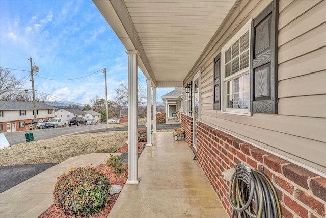 view of patio with a porch and a residential view