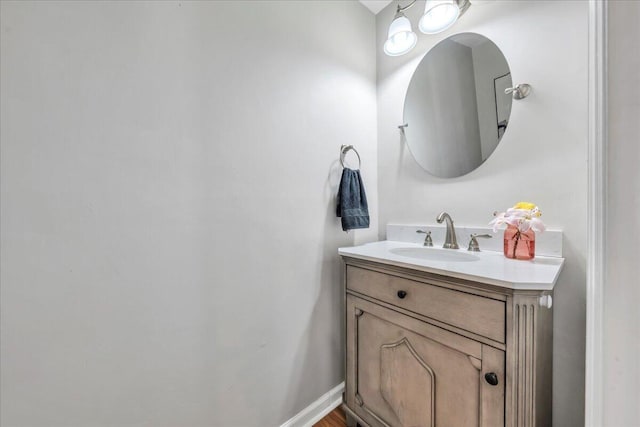 bathroom featuring baseboards and vanity