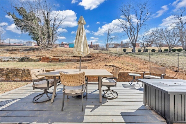 deck featuring fence and outdoor dining space