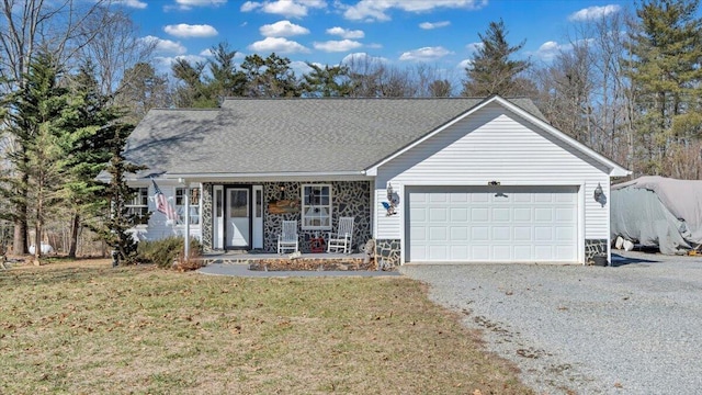 ranch-style house with stone siding, gravel driveway, an attached garage, a porch, and a front yard