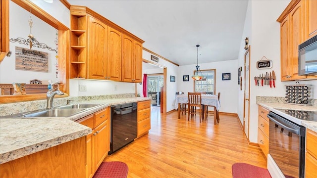 kitchen featuring open shelves, a sink, light countertops, black appliances, and light wood finished floors