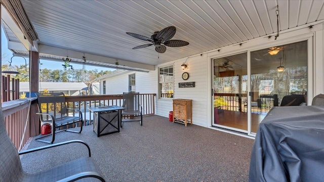 view of patio / terrace featuring a grill and a ceiling fan