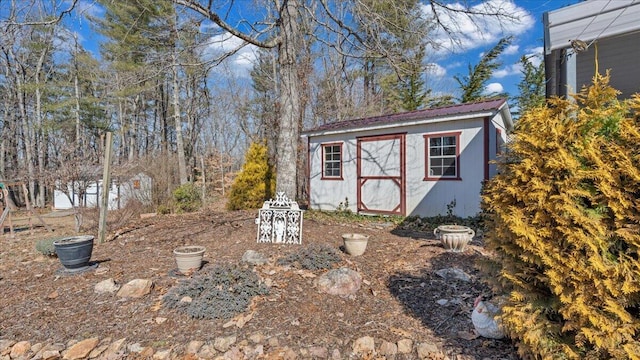 view of yard featuring an outbuilding and a shed