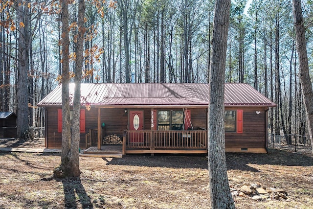 rustic home with crawl space and metal roof