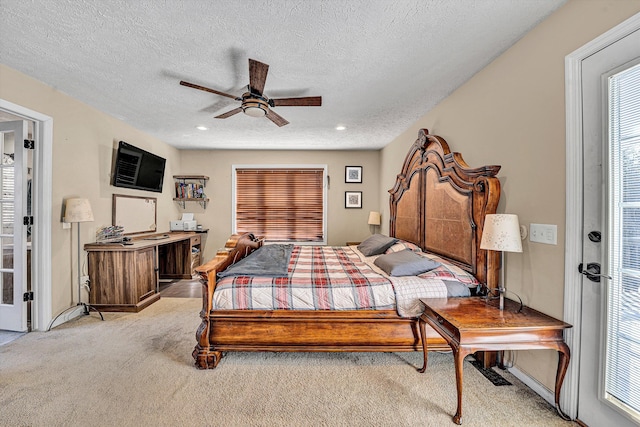 bedroom featuring recessed lighting, ceiling fan, a textured ceiling, and light colored carpet