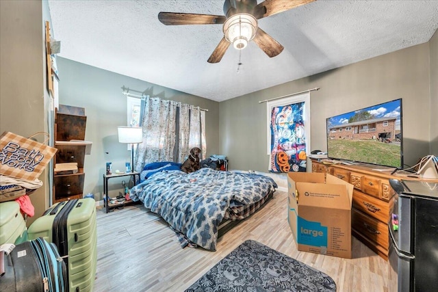 2930 Roanoke St, Christiansburg, VA 24073 - bedroom with a ceiling fan, wood finished floors, baseboards, and a textured ceiling
