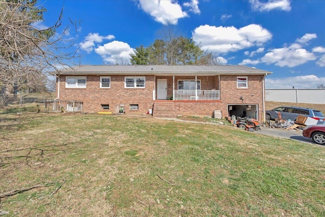 2930 Roanoke St, Christiansburg, VA 24073 - exterior space with brick siding, a lawn, metal roof, driveway, and an attached garage