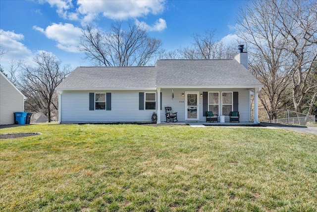 view of front of house with a chimney, fence, a front lawn, and roof with shingles