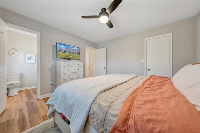 bedroom featuring light wood-style flooring, baseboards, and ceiling fan