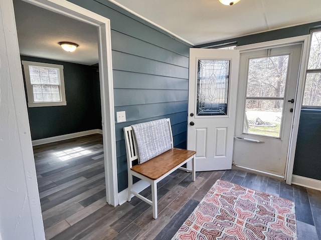 interior space featuring dark wood finished floors and baseboards