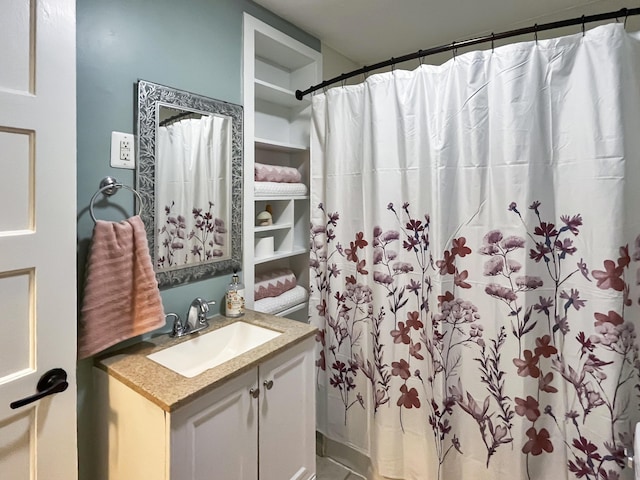 bathroom with a shower with shower curtain and vanity