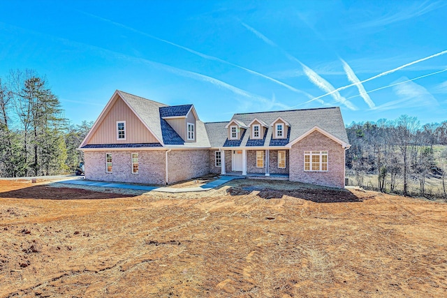 view of front of property featuring brick siding