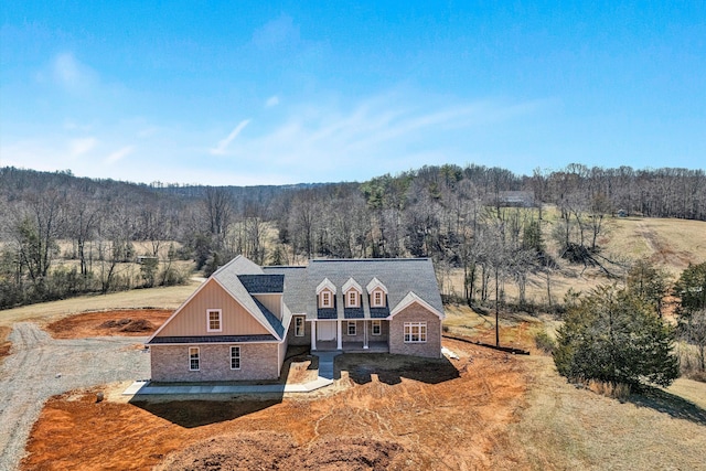 exterior space with a wooded view