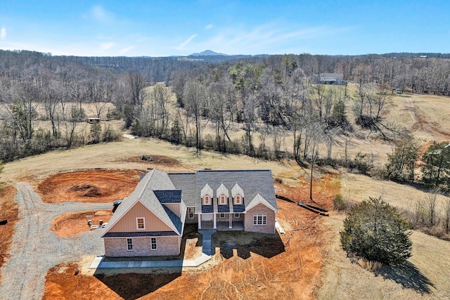 aerial view featuring a forest view