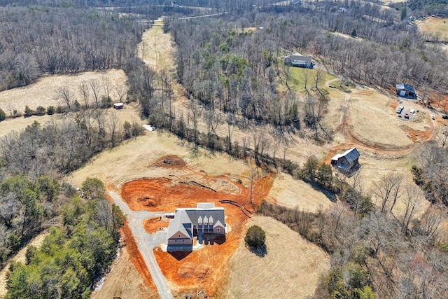 aerial view featuring a view of trees