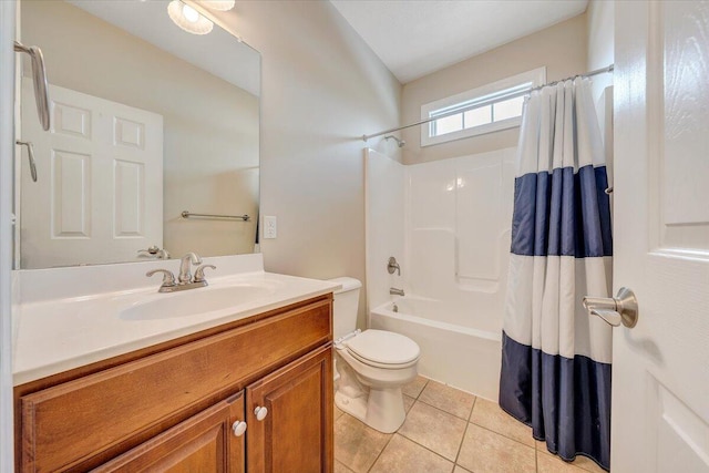 bathroom with shower / tub combo with curtain, vanity, toilet, and tile patterned floors