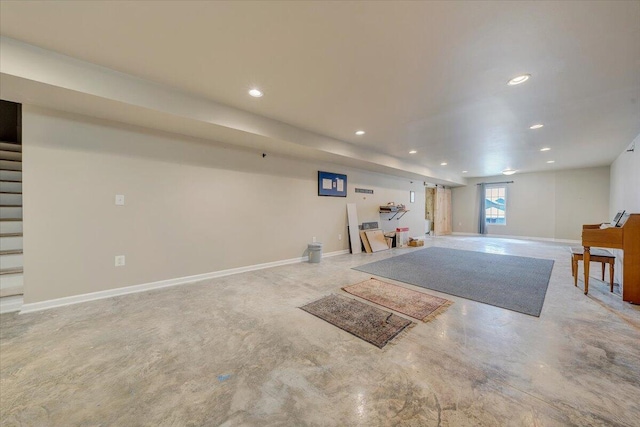 basement featuring stairs, recessed lighting, and baseboards