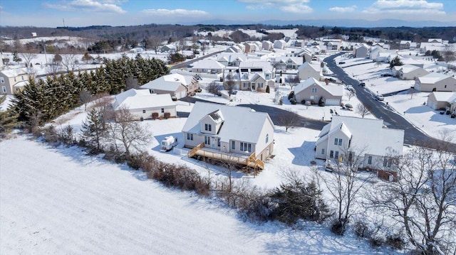 snowy aerial view featuring a residential view