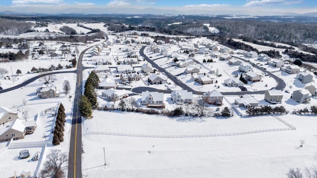 snowy aerial view featuring a residential view