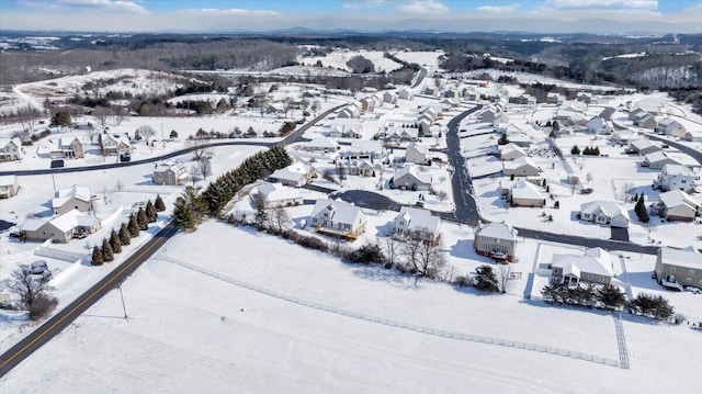 snowy aerial view featuring a residential view