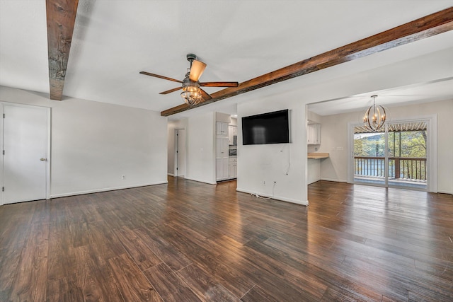 unfurnished living room featuring beamed ceiling, baseboards, dark wood-style floors, and ceiling fan with notable chandelier