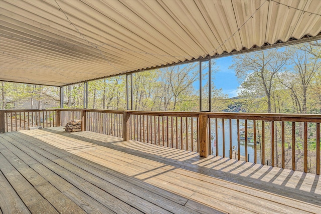wooden terrace featuring a water view