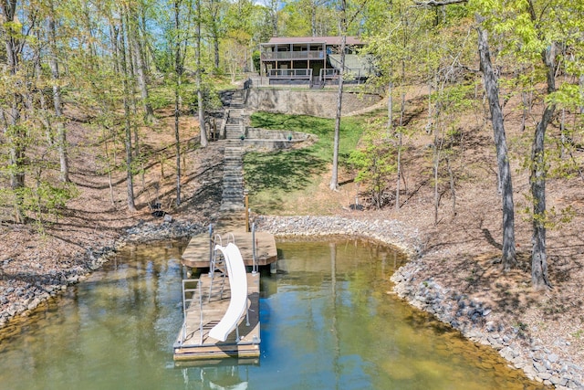 dock area featuring a water view and stairway