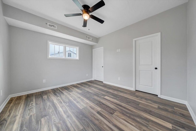 2236 Kenwood Blvd SE, Roanoke, VA 24013 - unfurnished bedroom featuring dark wood-style floors, baseboards, and a ceiling fan