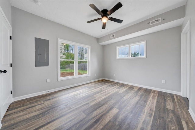 2236 Kenwood Blvd SE, Roanoke, VA 24013 - empty room with electric panel, healthy amount of natural light, wood finished floors, and a ceiling fan
