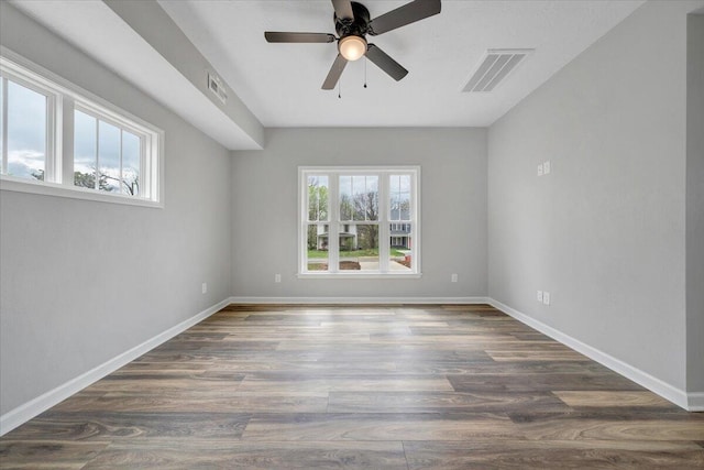 2236 Kenwood Blvd SE, Roanoke, VA 24013 - unfurnished room featuring healthy amount of natural light, a ceiling fan, wood finished floors, and baseboards