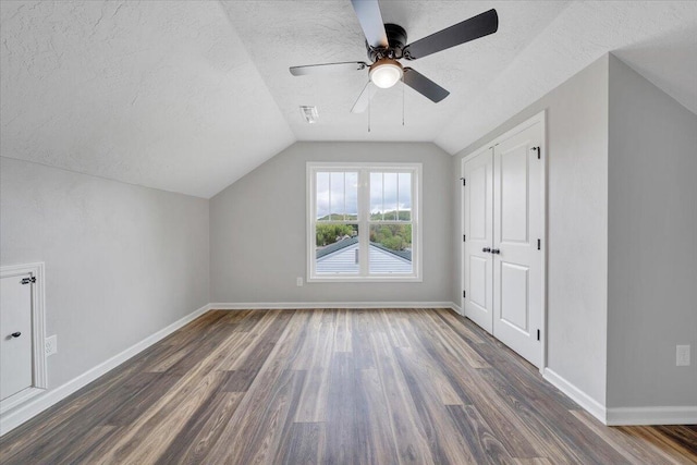 2236 Kenwood Blvd SE, Roanoke, VA 24013 - additional living space featuring dark wood finished floors, a textured ceiling, baseboards, vaulted ceiling, and ceiling fan