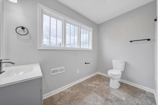 2236 Kenwood Blvd SE, Roanoke, VA 24013 - bathroom with baseboards, toilet, and vanity