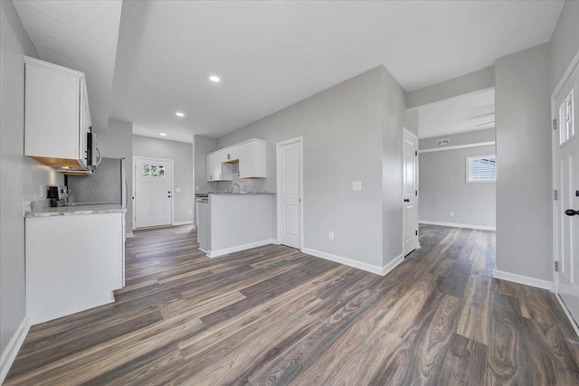 2236 Kenwood Blvd SE, Roanoke, VA 24013 - kitchen with dark wood finished floors, white cabinetry, recessed lighting, baseboards, and light countertops