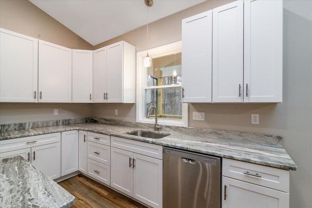 kitchen with lofted ceiling, white cabinetry, dishwasher, and a sink