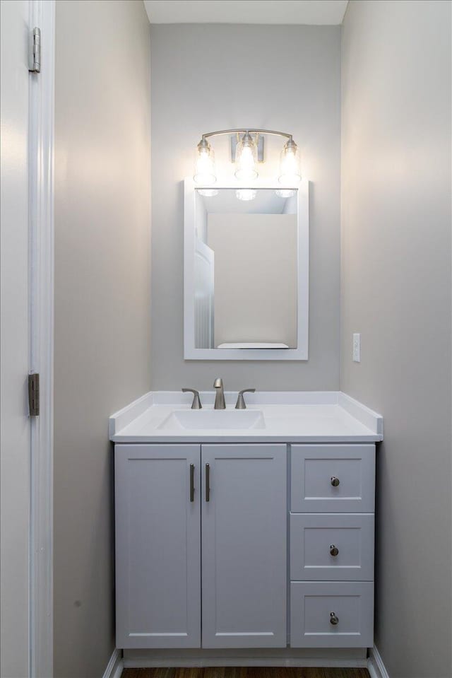 bathroom featuring vanity and baseboards