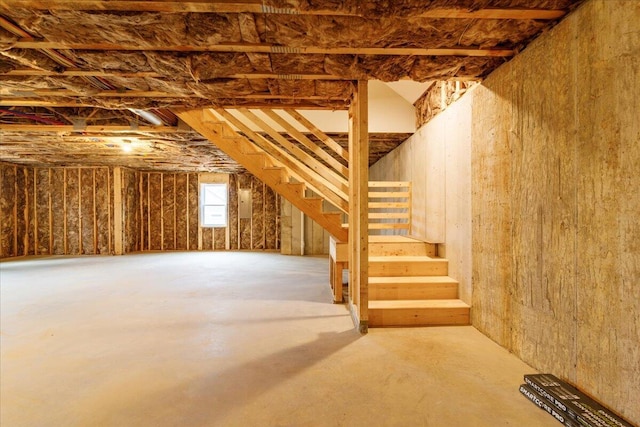 interior space with stairway and electric panel