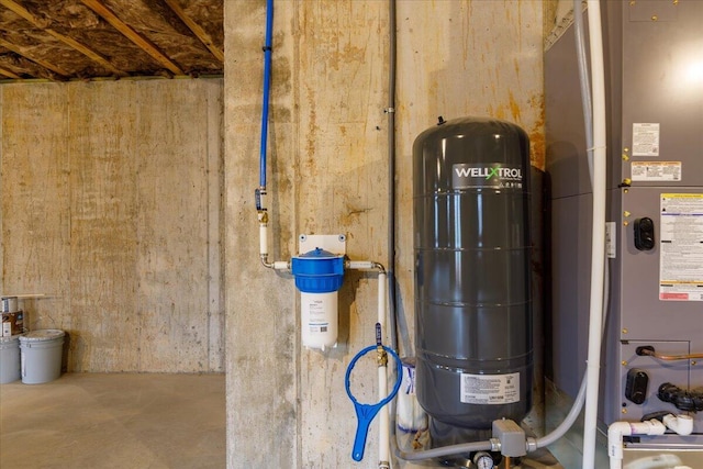 utility room featuring heating unit