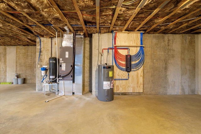 unfinished below grade area featuring water heater and heating unit