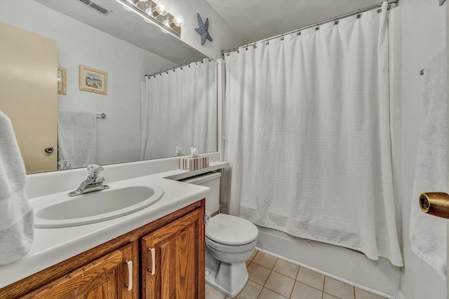 bathroom featuring tile patterned floors, visible vents, toilet, shower / tub combo, and vanity