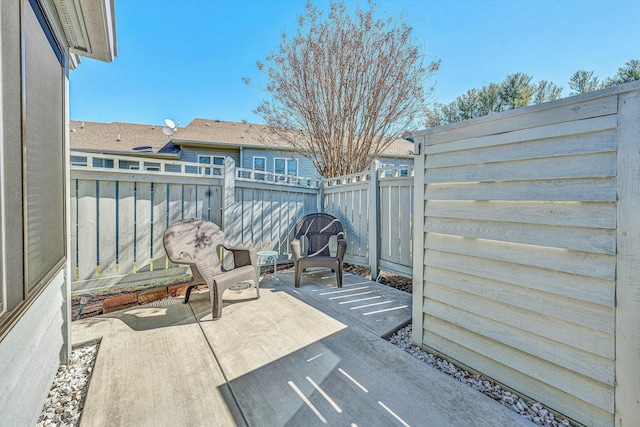 view of patio / terrace featuring fence