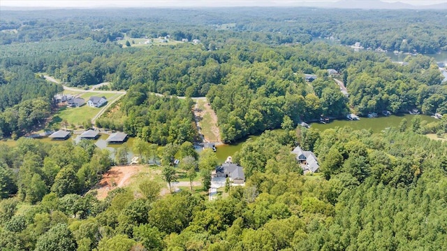 bird's eye view featuring a wooded view