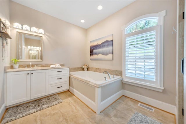 full bath featuring recessed lighting, visible vents, vanity, baseboards, and a bath