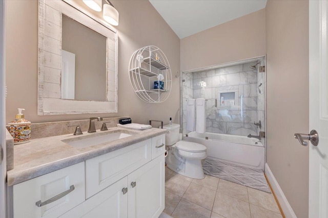 bathroom with baseboards, toilet, tile patterned floors, tub / shower combination, and vanity