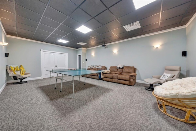 rec room with carpet, crown molding, visible vents, a drop ceiling, and baseboards