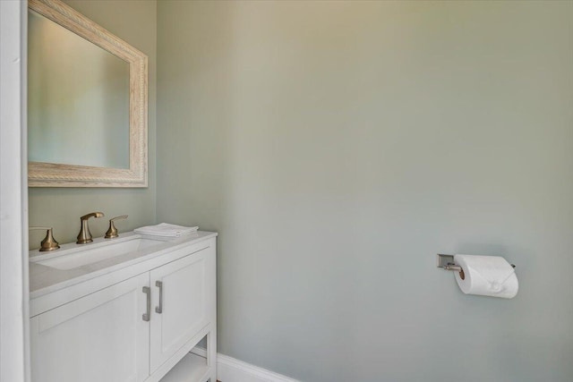 bathroom featuring baseboards and vanity