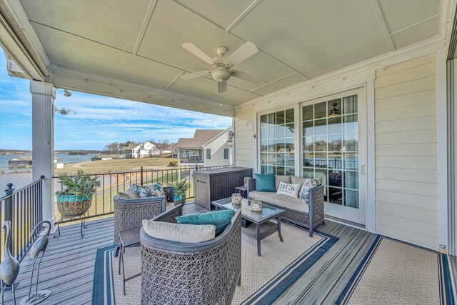 wooden deck featuring a ceiling fan and outdoor lounge area