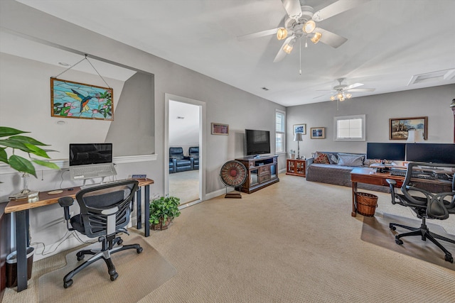 carpeted home office featuring ceiling fan and baseboards