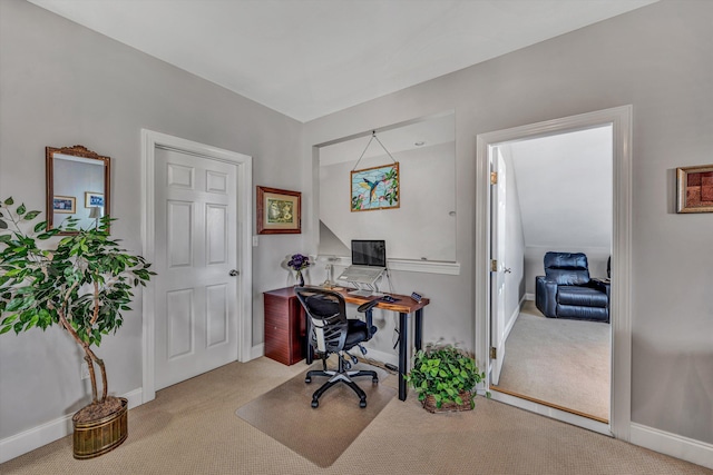 home office featuring carpet flooring and baseboards