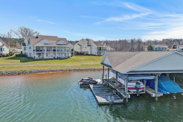 view of dock featuring a residential view, a water view, a lawn, and boat lift