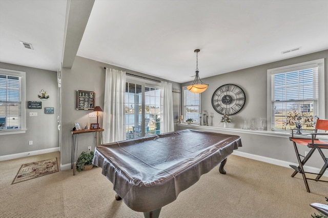 recreation room with carpet, visible vents, and baseboards